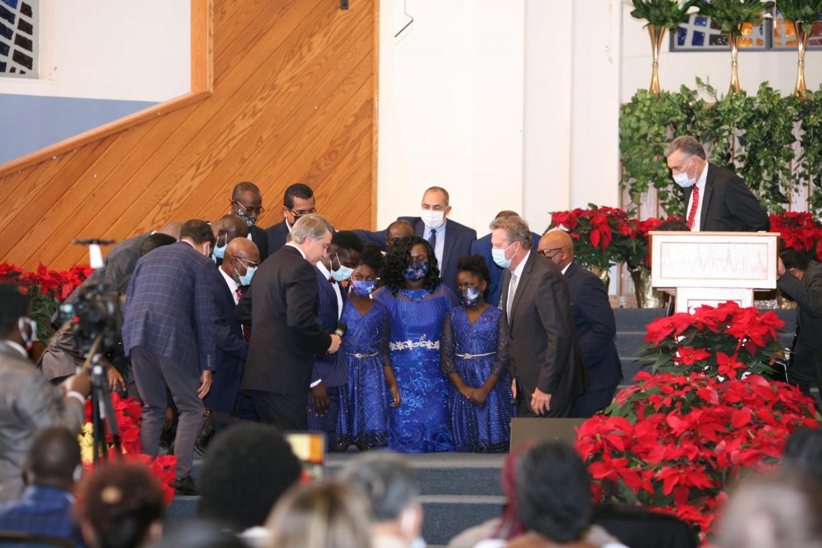 Leaders from across the Columbia Union Conference gather around the Asiedu family as Emmanuel Asiedu is ordained