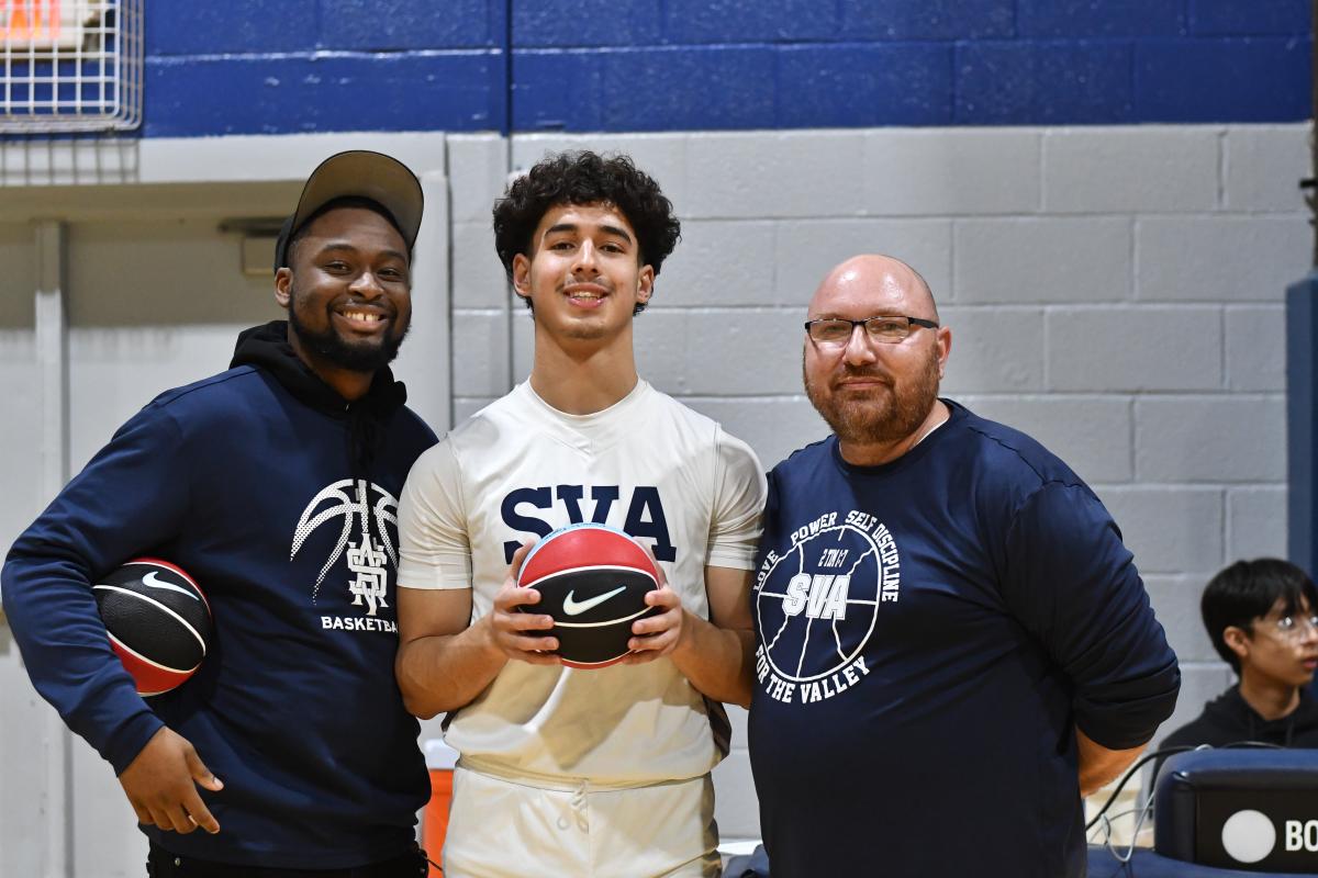 Tahkai Martin (left), a Shenandoah Valley Academy task force worker who also served as the boys’ junior varsity basketball head coach, is pictured with Aleks Ullrich (’25) and Steven Foote, boys’ varsity head coach.