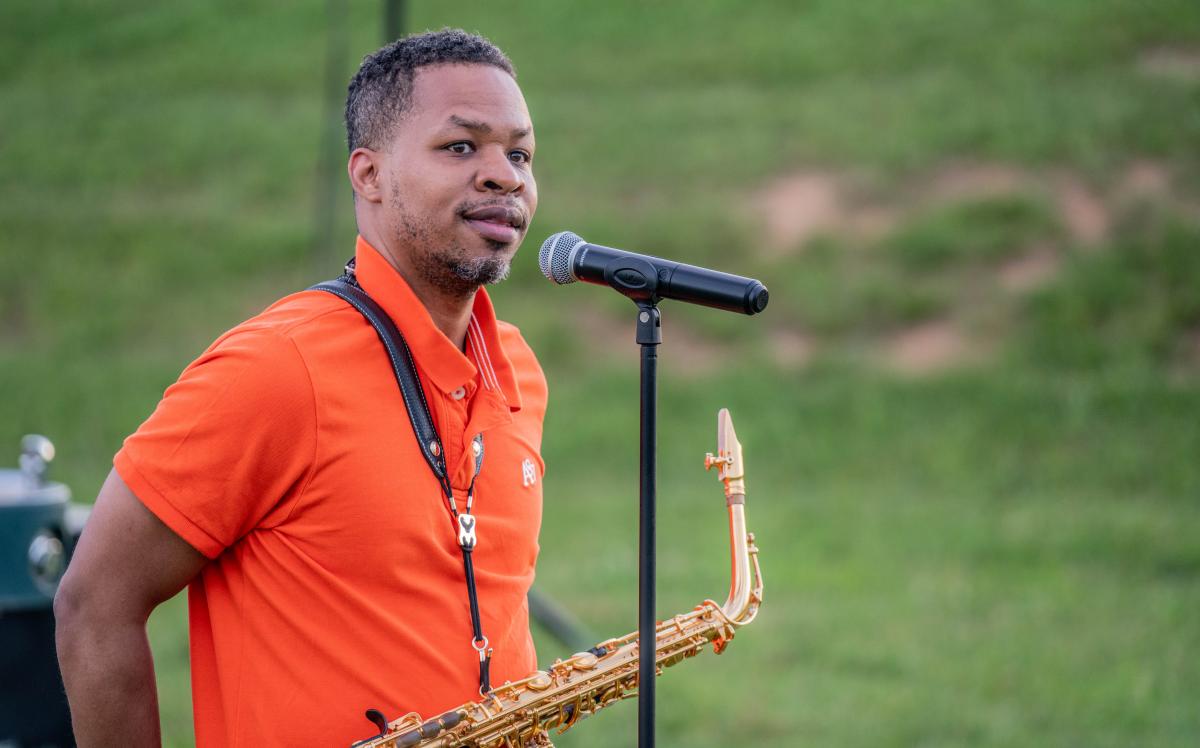 Leighton Kennedy, a member of Emmanuel-Brinklow church prepares to play a song during the Community Prayer Vigil.