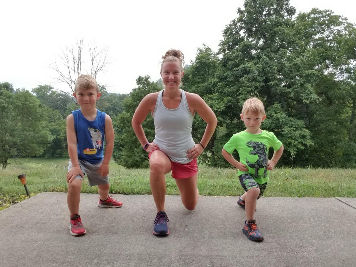 Lukas and Jakob Wagner assister their mother, Keri, in an exercise class on Facebook