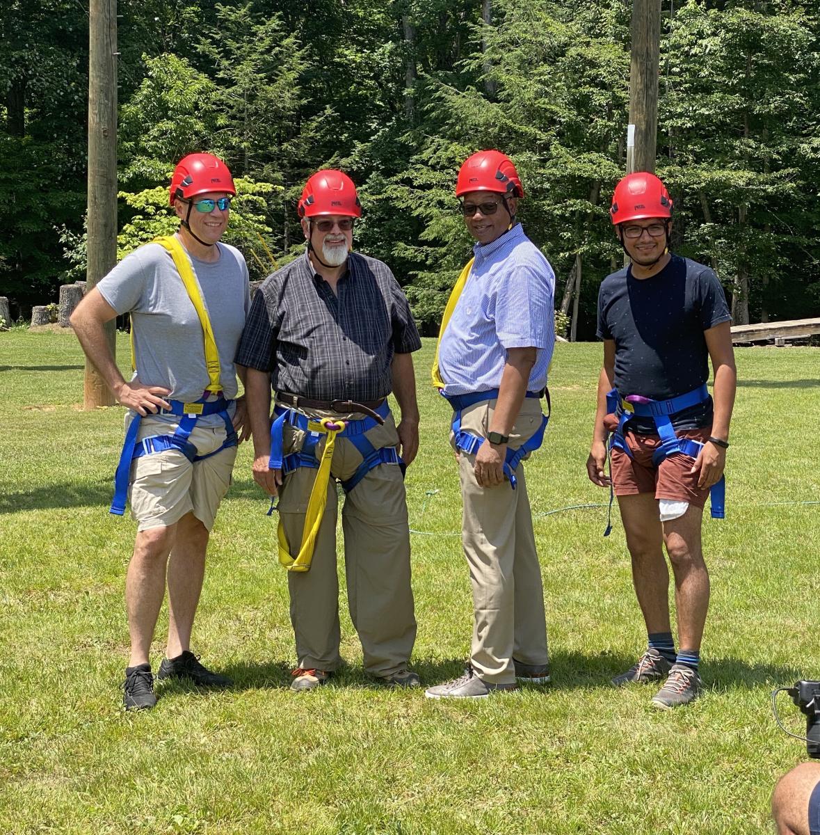 Bob Cundiff, Ohio Conference president; Tim Bailey, Mountain View Conference (MVC) president; Marcellus T. Robinson, Columbia Union Conference president; and Walter Cardenas, assistant to the MVC president, prepare for the ropes course.