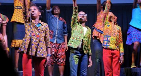 Youth from the Watoto Children Choir, a Christian ensemble from Uganda made up of orphans or kids living in difficult situations, sing songs of God’s love to members at the Columbus Central church.