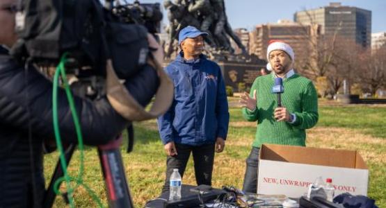WGTS morning show host Jerry Woods encourages listeners to donate toys in a live broadcast with ABC 7.