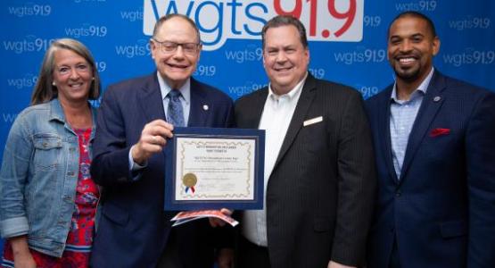 Mayor Bridget Newton (left), and councilmembers Sidney Katz and Will Jawando (right), declare August 23, 2019, "WGTS 91.9 Day," awarded to President and General Manager Kevin Krueger (second from right).