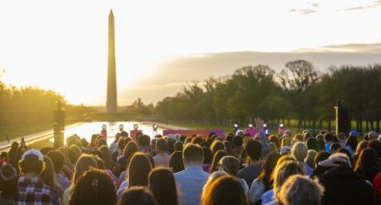 The sun rises over the Washington Monument. The sun rises over the Washington Monument.