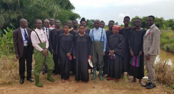 Emmanuel Aseidu (pictured right) gathers with baptismal candidates and church leaders in Ghana