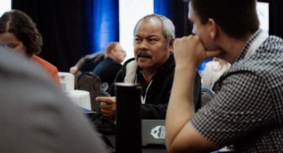 Transformational Evangelism attendees discuss evangelism methods following a presentation. Photo by Brian Tagalog