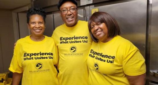 Gale Walker, George Jones and Karen Jones have a wonderful experience serving breakfast to 67 women and children at a domestic violence shelter