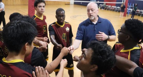 Members of the Atholton Royals volleyball team listen to Head Coach Geofferey Hyde’s instructions during a game. Chesapeake Conference, Atholton Adventist Academy, Royals, Geofferey Hyde, Chesapeake Conference, Royals Sports Teams: Winning Ethically Is the Goal