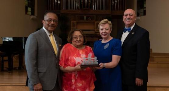 Claudio and Pamela Consuegra (right) presented the NAD Distinguished Service Award for Family Ministry to Buford and Carmen Griffith (left) on Saturday, July 20, during the Adventist Conference on Family Research & Practice. Photo credit Darren Heslop, University Communication staff photographer