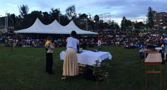 Dillon Smith, 12, speaking to about 1,000 people at a park in Karongi, Rwanda, on Sunday evening. (Jackie O. Smith) via Adventist Review