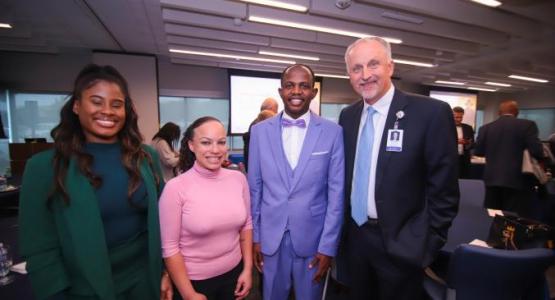  Inaugural Lucy Byard Scholarship winners Tianna Lawrence, Erica Martell and Junior Philogene celebrate with Adventist HealthCare President and CEO Terry Forde at the awards luncheon held on Oct. 4.
