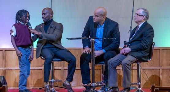 Mark Moise, a student from George E. Peters, responds to a question posed by panelists Trevor Kinlock, Benjamin Baker and Douglas Morgan. Conference Celebrates 80-Year Legacy, Allegheny East Conference, Trevor Kinlock, Emmanuel-Brinklow church, George E. Peters Adventist School, Pine Forge Academy, Baltimore Junior Academy