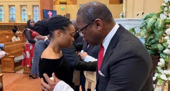 Lewis Miles prays with Kassinda Kerr during the Berea Temple church anointing and prayer service. Berea Temple Hosts 40 Days of Prayer, Allegheny East Conference, Maurice Taylor, Dennis Smith
