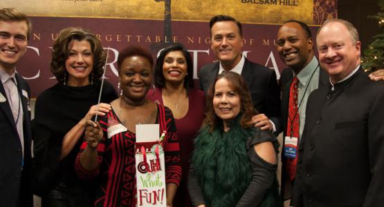 Afternoon show host Tom Miner and morning show host Jerry Woods pose with winners who won a chance to meet Michael W. Smith, Amy Grant and musical director David Hamilton.