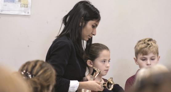 BMA student Helmi Calles leads a handbell choir at the nearby Blue Mountain Elementary School. Blue Mountain Academy, Helmi Calles