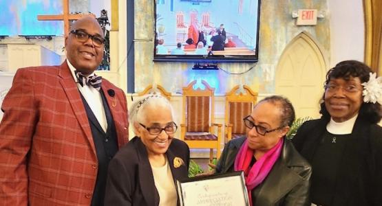 Jerome M. Hurst, pastor of the Ethnan Temple church, presents an award to Geneva Mosby, alongside church members Cheryl McKnight and Beverly Moore. Ethnan Temple Honors 90-Year-Old Pillars of Faith, Allegheny West Conference, Jerome M. Hurst, Geneva Mosby