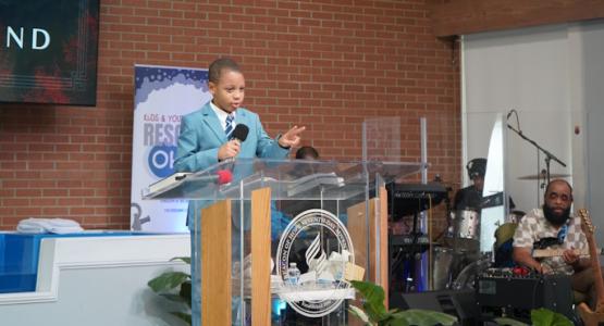 Seven-year-old Kiseki Copeland preaches during Youth Pentecost and Pentecost Kids at the Beacon of Hope church. Young Hearts Shine for Jesus During Pentecost 2025, Allegheny West Conference, Rescue Ohio, Tanya Muganda, Neighborhood Services Inc. Food Pantry, Habitat for Humanity, Wilkenson Bissereth, Kiseki Copeland