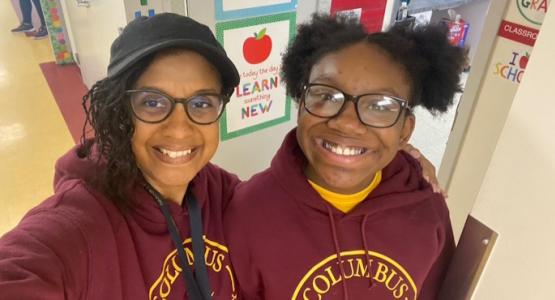 Evelyn Goodman, Columbus Adventist Academy Students line the hall of the new high school wing. principal, takes a selfie with fifth-grader Nariyah Harvey-Destin. CAA Moves Toward High School Status, Evelyn Goodman, Allegheny West Conference, Marvin C. Brown, III, Columbus Adventist Academy, Columbia Union Conference,