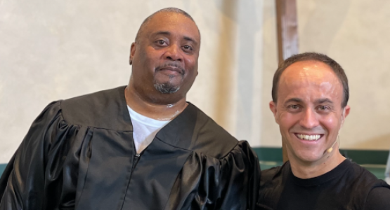 Diego Boquer, senior pastor of the Baltimore-White Marsh church, baptizes Travis McClurkin. Diego Boquer, senior pastor of the Baltimore-White Marsh church, baptizes Travis McClurkin.