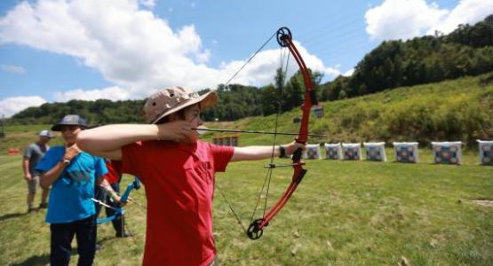 William Cross, a Pathfinder from Mountain View Conference's Elkins Black Bears, aims for a bull's-eye during an archery activity