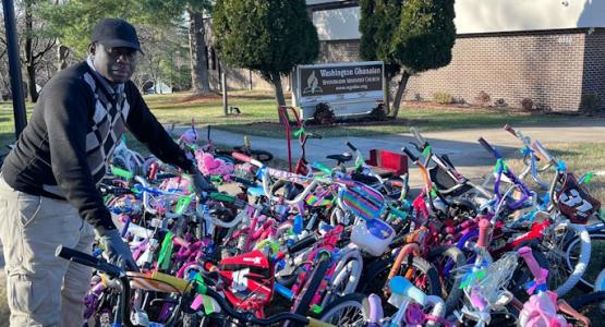 Washington Ghanaian church member Paul Otoo works to ensure children receive ready-to-ride bikes. Washington Ghanaian Gives 100 Bikes to Kids, Chesapeake Conference, bicycles,