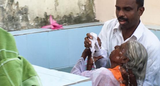 Swamidas Johnson, director of Hope Channel India, baptizes one of the many candidates that attended the 10-day evangelistic series held in the Vyasarpadi district of Chennai, India.