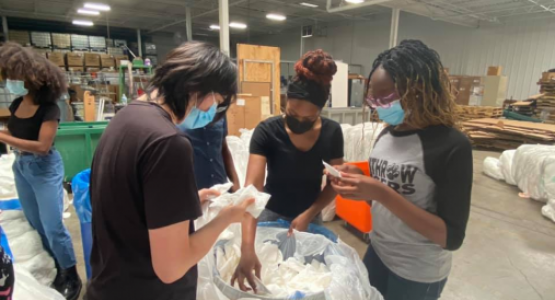 Clifton members Houpu Xu, Lawrencia Robinson and Farrah Mugwisi sort medical supplies for shipment to overseas disaster zones at the Matthew 25 Ministries community center.