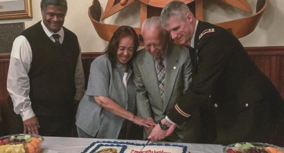 Sendry O. Pittman, Sr. (center), his wife, Doris, and Lieutenant Colonel Vincent B. Myers, commander of the McDonald Army Health Center, celebrate the newly named volunteer program.