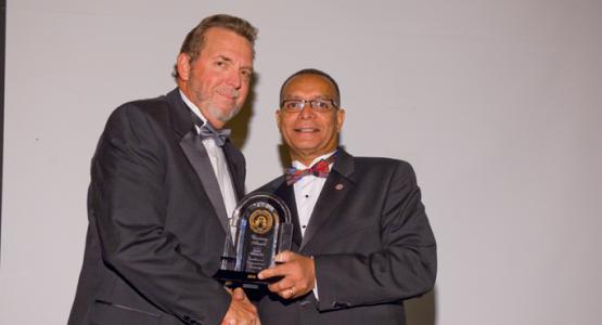 Weymouth Spence, WAU president (right) honors Dave Weigley, Columbia Union Conference president, at WAU's Visionaries Gala.