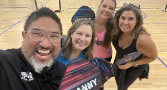 Coach Jay Alignay (left) and his wife, Becky, have become good friends with Jay's colleague, Dawn Stem (right), and her daughter, Jordan Delong.