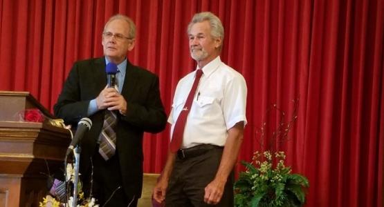 Jim Buchanan (right), pastor of the Cumberland/Frostburg church district, welcomes Don Kelly, a former Mormon, as the newest member of the Frostburg church.