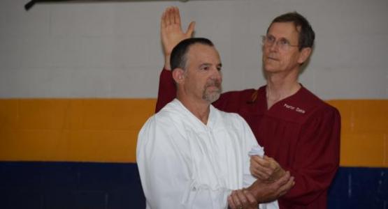 At this year's Pennyslvania Camp Meeting, Mark Dekle, pastor of the Walnutport church, baptizes Doug Seipt.