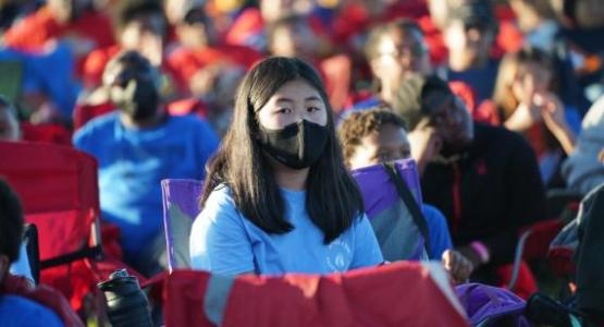 Camper at Relentless2022, Columbia Union Camporee listens to the nightly meeting. Image by Stephen Lee