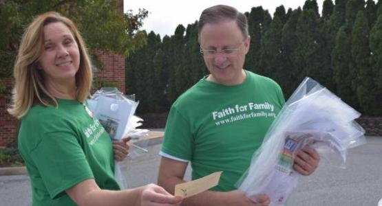 Michelle Becker, Allentown church member, and Gary Gibbs, conference president, prepare to go door to door in the community to pray with people and offer Bible studies, as part of the Faith for Family initiative.