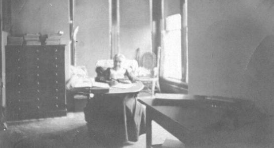 This photograph of Ellen White at her Elmshaven writing desk may have been taken by Charles L. Taylor or Lucy Brown Taylor during the years they lived near the St. Helena Sanitarium. Charles Taylor served as Sanitarium chaplain at the time that Ellen White moved to Elmshaven in 1901. Photograph from the Taylor Family Collection (PUC.MSS.096). 