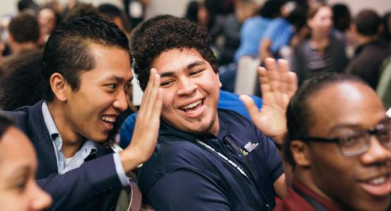 Ro Sang Puia, Chesapeake Conference’s youth pastor for the Eastern Shore, and Kevin Jimenez, a member of the Pennsylvania Conference’s Kennett Square (Pa.) Hispanic Company, enjoy a young adult summit activity. 