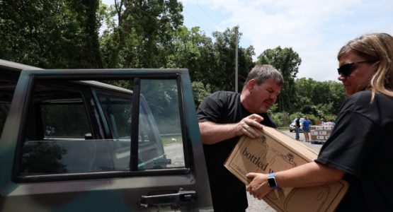 Grandview Hospital employees worked with employees from the Harrison Township Police office (pictured right) and members from an area church in Northridge to provide water to impacted area residents. Grandview Hospital employees worked with employees from the Harrison Township Police office (pictured right) and members from an area church in Northridge to provide water to impacted area residents.