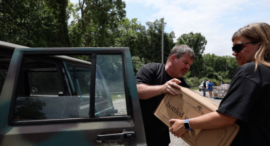 Grandview Hospital employees worked with employees from the Harrison Township Police office (pictured right) and members from an area church in Northridge to provide water to impacted area residents.