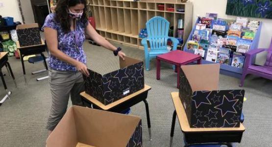 A teacher at Mt. Aetna Adventist School prepares her classroom for the upcoming year. 