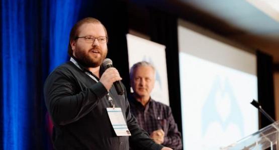 Ryan Comeau, associate pastor at Hagerstown, accepts an award for the Christ Con project. Photo by Brian Tagalog