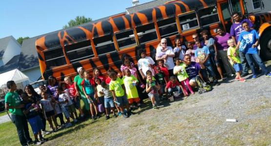 Staff at Cambridge (Md.) church's FLAG camp pose with campers.