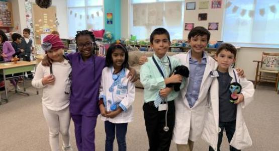 Interested in the medical field, second-graders Ely Fallet, Maya Peters, Serina Ninala, Josias Serrano, Jonathan Malin and A. J. Rivera, dress the part.
