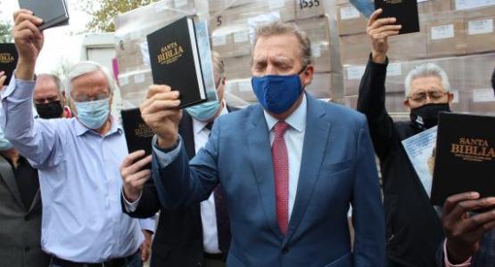 Columbia Union President Dave Weigley and other leaders pray over Bibles that were sent around the union.