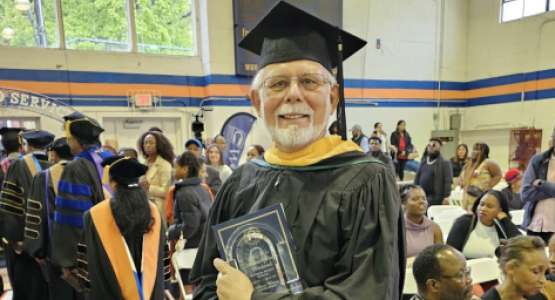 Ken Flemmer, executive director of Adventist Community Services of Greater Washington, displays Gateway to Service Award.