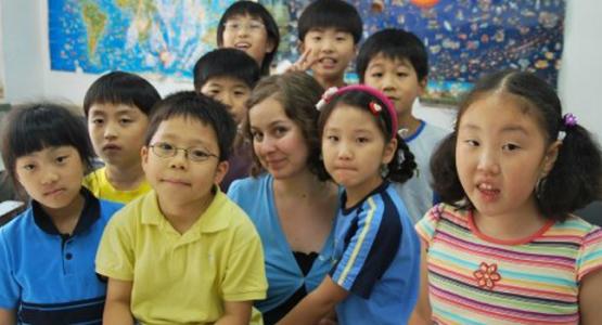 V. Michelle Bernard poses with her former students at the SDA Language Institute in South Korea.