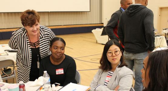 Lanelle Cobbin speaks with teachers from G.E. Peters at an Encounter curriculum training.