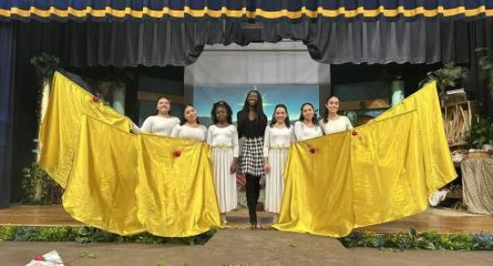 Naomie Charles (center) joins Lake Nelson Adventist Academy students at a holiday program. Naomie Charles (center) joins Lake Nelson Adventist Academy students at a holiday program.