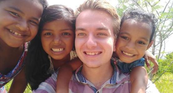 Student missionary Nathan Moravetz hangs out with three church friends in Yap.