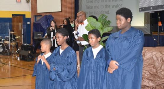 First-grader Emillio Walker, fourth-graders Serena Sterling and Aiden Lalittle, and eighth-grader Meghan Valcine prepare for baptism at the Week of Prayer’s culminating church service. Lake Nelson Adventist Academy, New Jersey Conference